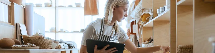 A women holding tab and checking something