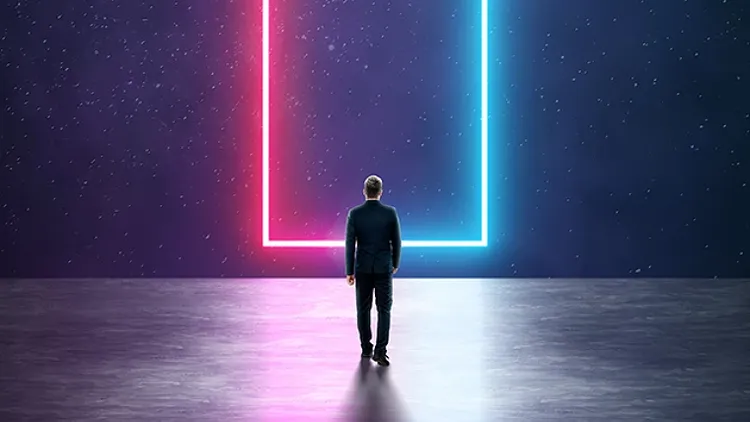 Man standing in front of an outlined doorway with red and blue neon lights