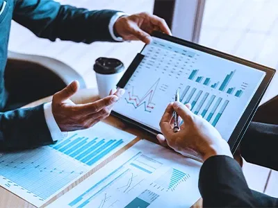 Closeup view ofan open folder with hands hovering over the documents