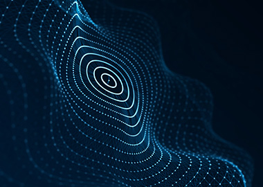 An abstract image of glowing circular lines against a black background 