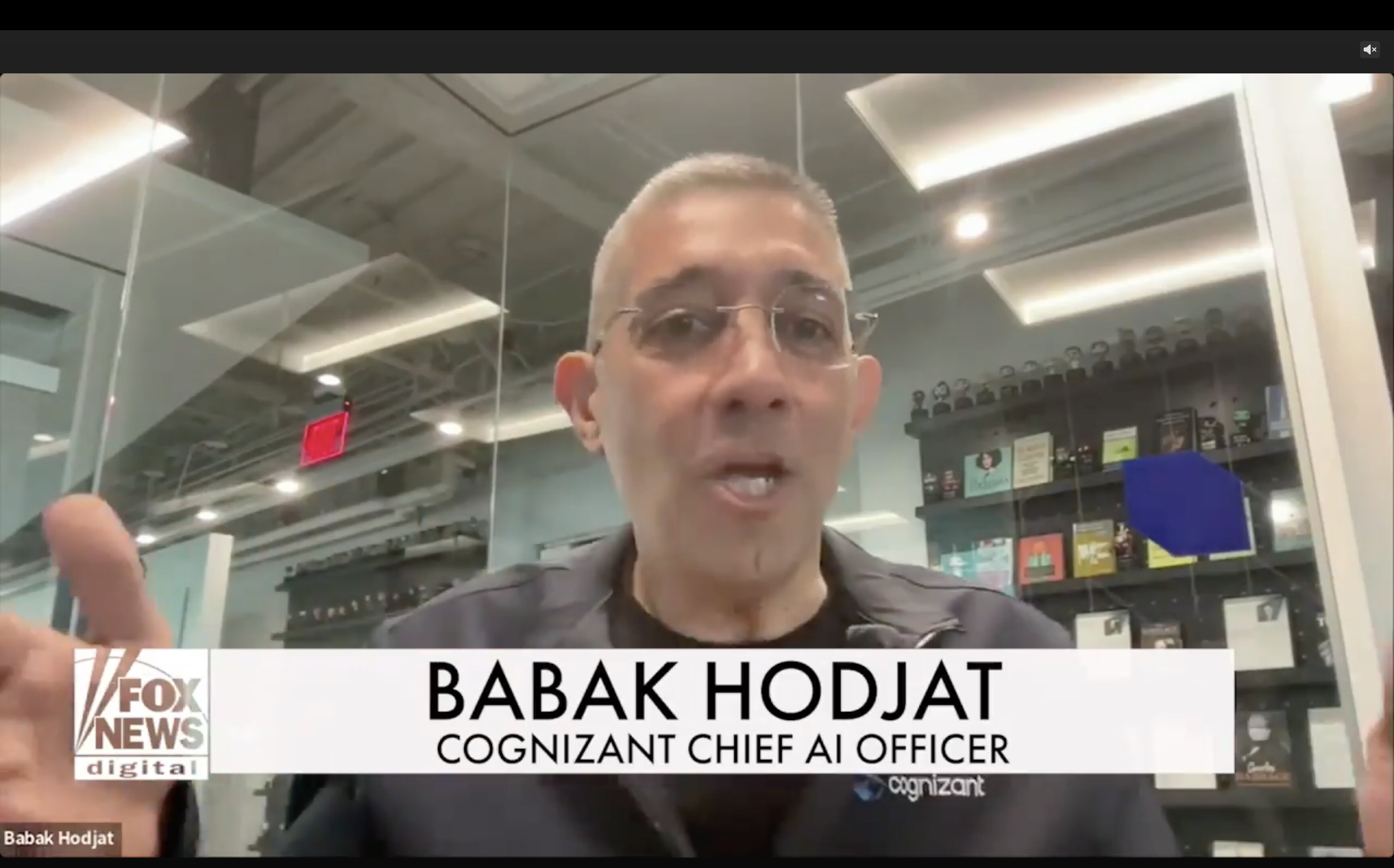 Babak Hodjat in glass office speaking to camera