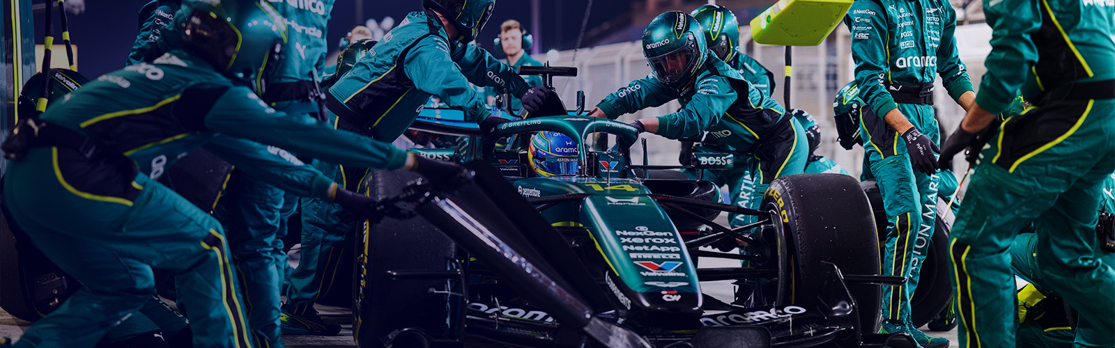 Abstract 3D geometric background featuring blue and green triangles arranged in a dynamic pattern