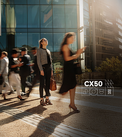 Businesswoman standing still on a busy street