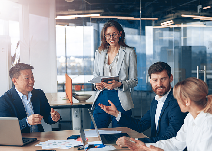 A group of colleageus at an office meeting