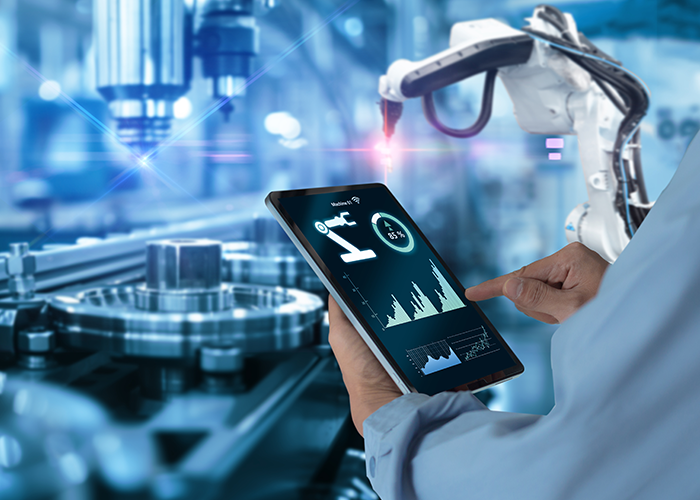 A man is using Ipad in a digital industry