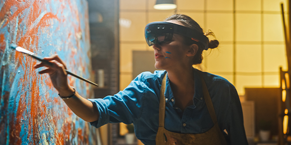 A girl painting in the wall