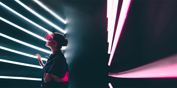 A women wearing a vr glass surrounded by glowing neon lights