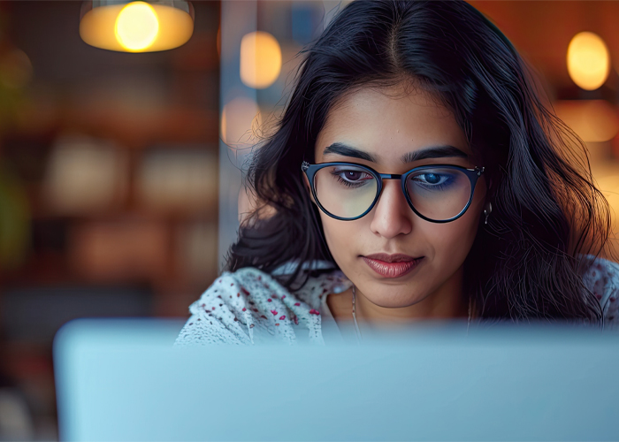 a person looking at a laptop screen
