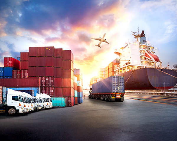 A large cargo ship is docked at the port, loaded with containers and ready for its next journey.