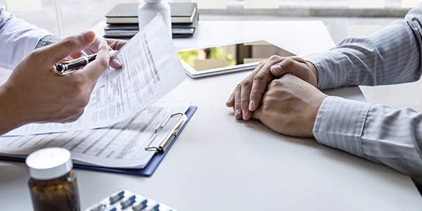 Doctor and patient are discussing consultation about symptom problem