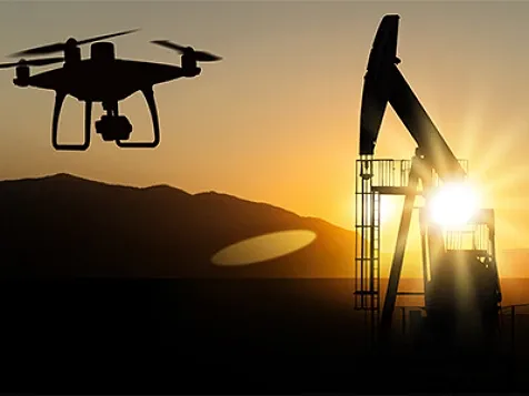 A drone flying over an oil rig