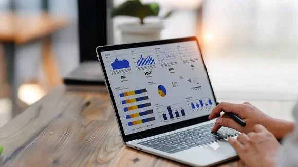 Hands of person are engaged in typing, indicating active work in modern office environment