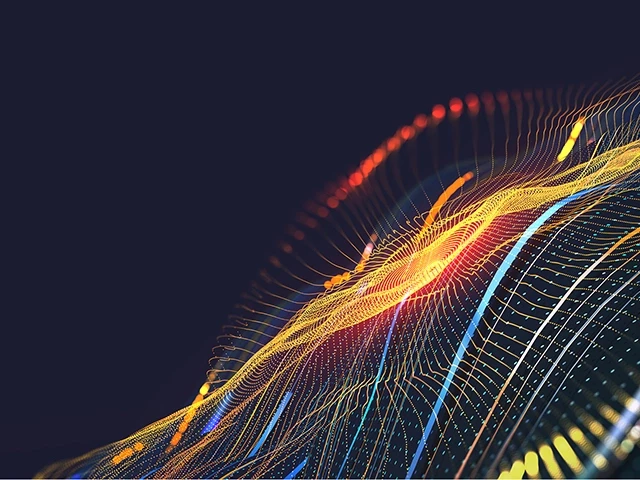 Abstract digital wave background featuring flowing lines and gradients in vibrant colors.