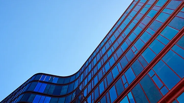 A low-angle view of a glass fronted building