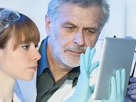 Scientists viewing a report