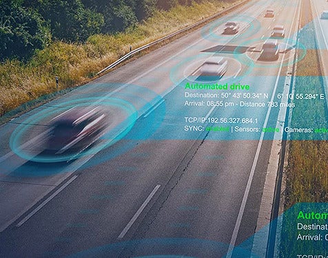 Fast moving cars on a road with an overlay of tracking details