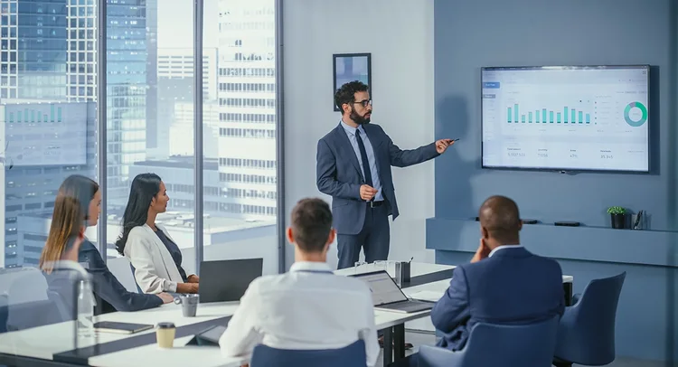 A man presenting in a team meeting