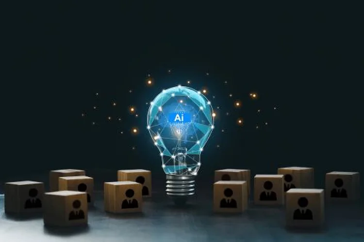 An upright, independently standing incandescent light bulb, enveloped with networked lines enveloping it, and several dices with a human icon on each one arranged around the bulb