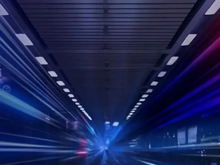 Futuristic tunnel with blue light trails and motion blur effect