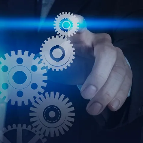 Pointer finger reaching out, pointing to an overlay of white graphic gears