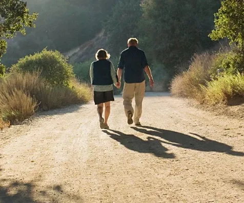 old man and woman walking