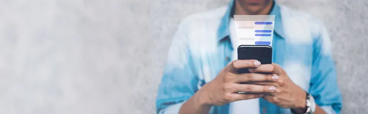 A man scrolling through his smartphone