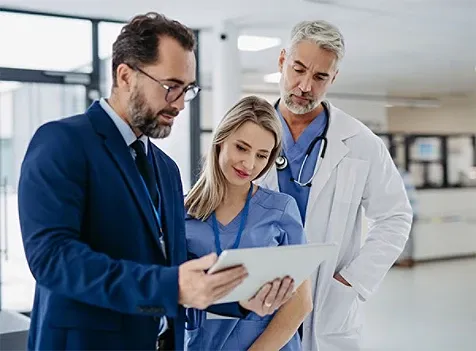 Healthcare professional discussing with tablet