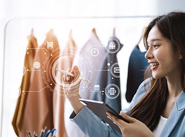 Female designer design a product using digital tablet in a modern studio