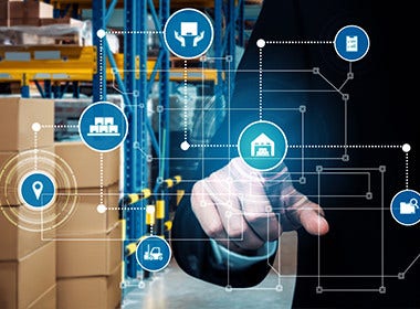 Hand interacting with digital supply chain network over warehouse shelves