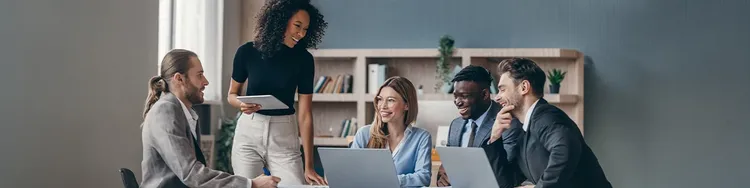A group of colleagues attending an office meeting