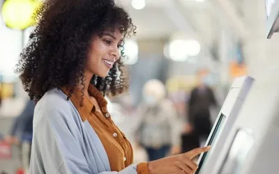 A woman interacting with a digital screen
