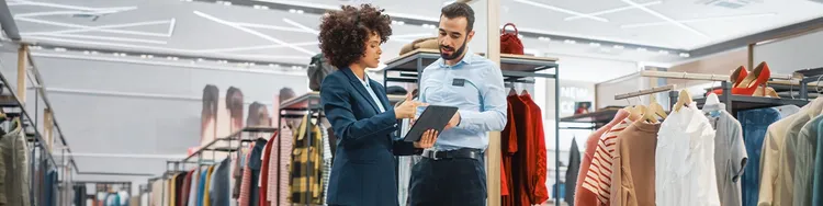 Professional using laptop examining AI workflow diagrams on digital screen