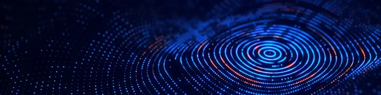 Abstract image of blue circular lines over a digital board against a black background