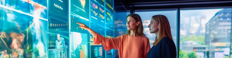 two people pointing fingers at a digital screen