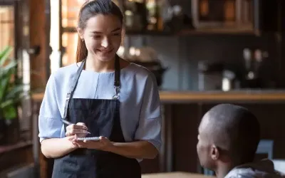 A women waiter taking order