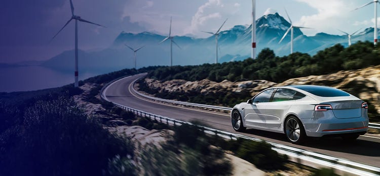 An image of a car going through wind farms