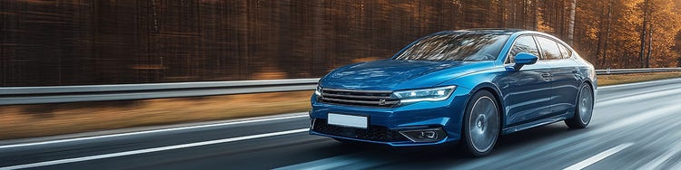 A modern car running on an highway