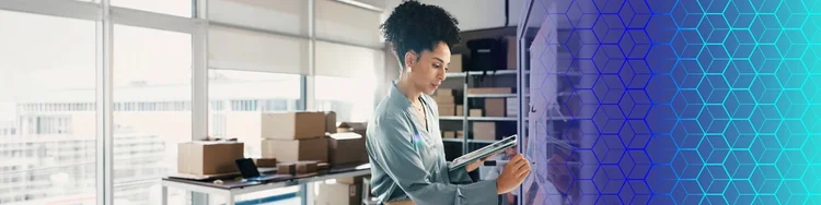 Professional using a tablet for AI-powered warehouse and inventory management.