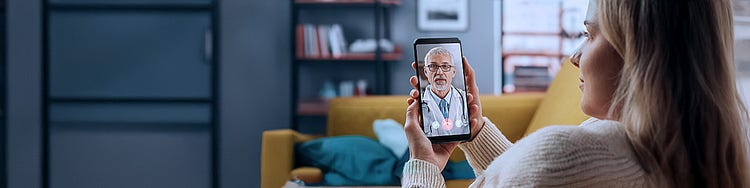 A woman consulting doctor through her mobile