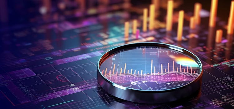 Image of a magnifying glass focused on graphs