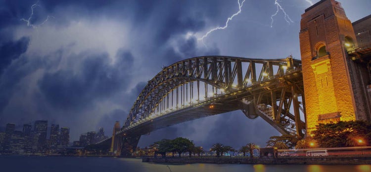 A bridge with lights and sky looks too dark with lightening.