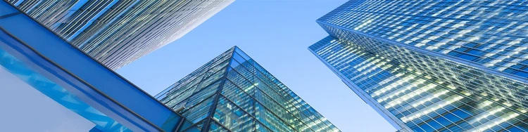 Looking up around with tall glass buildings