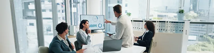 Colleagues having a discussion in a meeting room