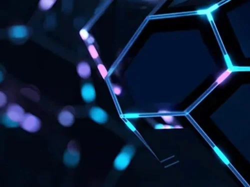 Abstract image of glowing hexagons with blue and purple neon outlines on a dark background, conveying a futuristic and digital atmosphere.