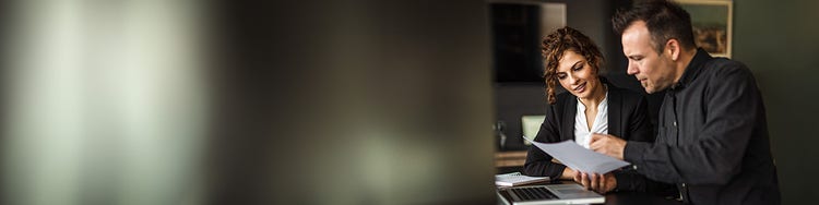 Two people reading from a file