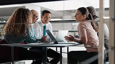 A group of people in a meeting