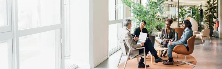 People listening to someone in a meeting