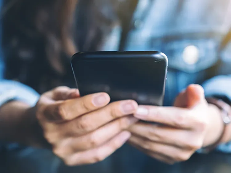 Customer accessing 24/7 customer support through their smartphone