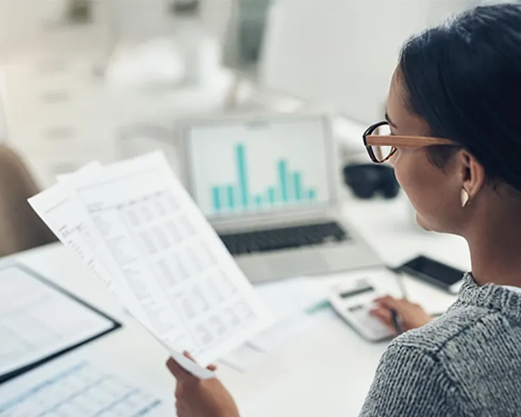 A woman looking into reports online