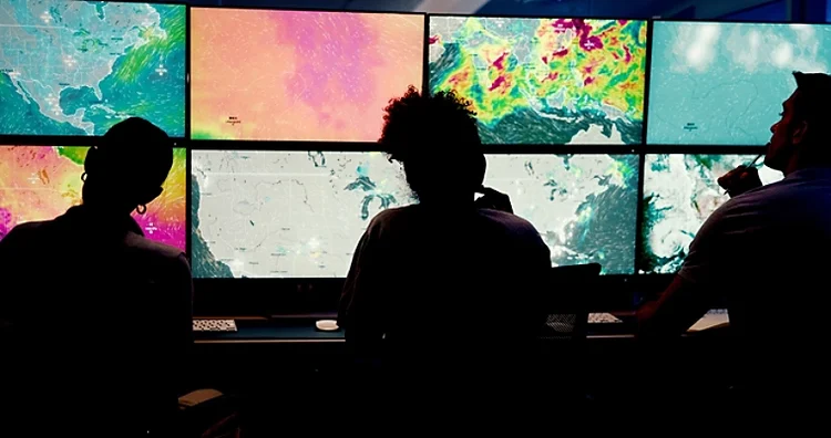 People, screen or monitor with weather for forecast, satellite maps or teamwork to track storm